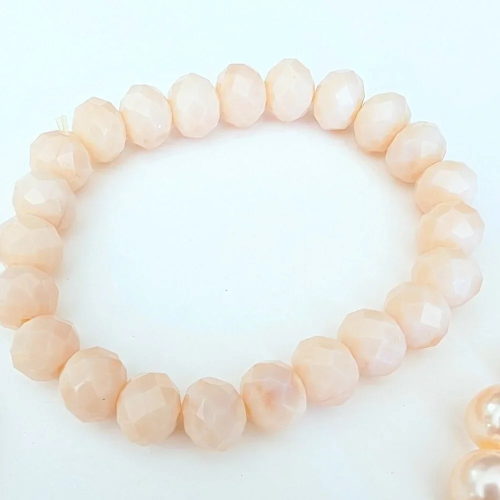 Bundle of nude and natural beaded stretch bracelets